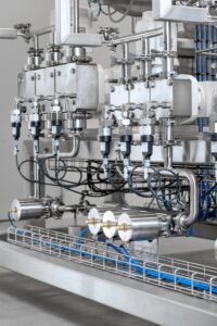 Oligonucleotide Production: Dilution System for Production with Highly Varying Flow Rates